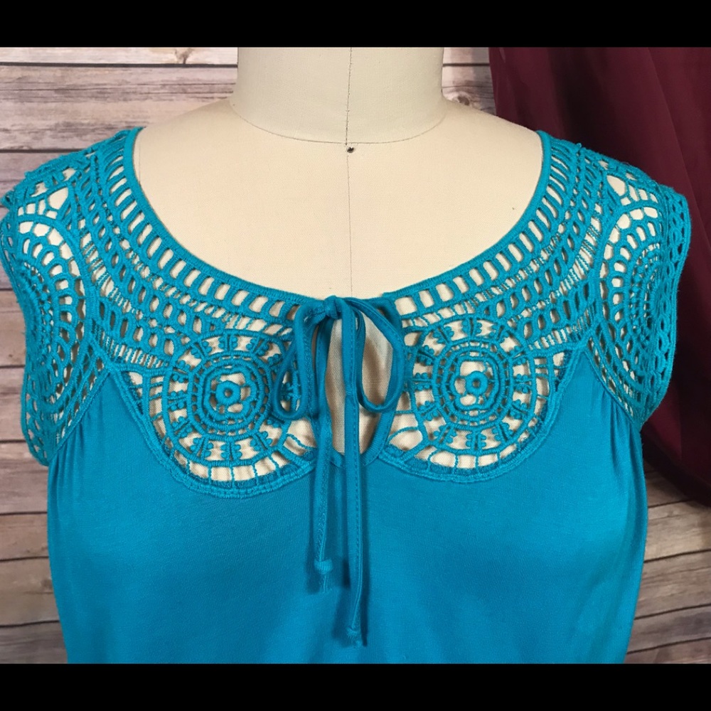 Blue dress with lace yoke detail.